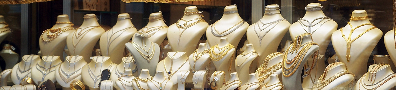 Necklaces made of gold and precious metals on display in a jewelry store