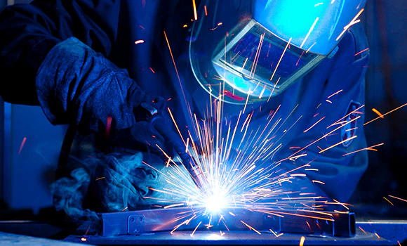 Metal fabrication employee at work